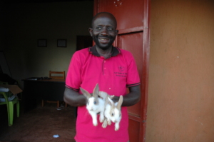 Richman holding rabbits that were passed  to him