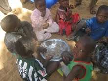 Students at Bonfeba school eating lunch.