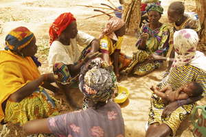 Women discussing what they've learned in Mari