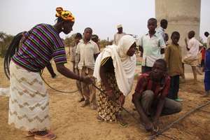 Mentors Dafani & Ramatou with gardener Tchindo
