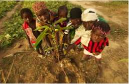 Nassile girls pose with tree seedling