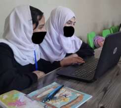 Afghan girls practicing their computer skills
