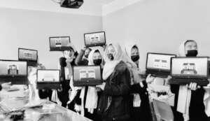 Proud students display their work