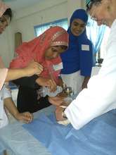 A birth attendant receives additional training.