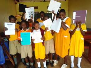 Salama students receiving donated Braille books