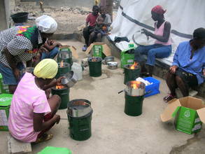 Haitian women cooking with new Rocket stoves