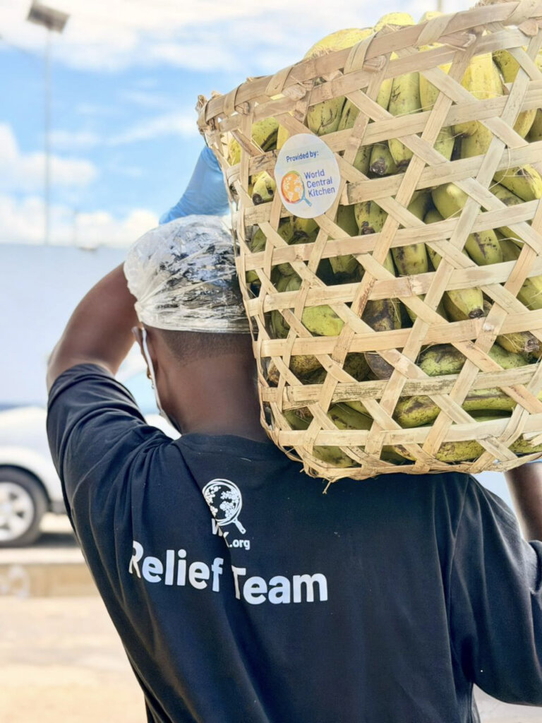 A volunteer carries bananas in Madagascar