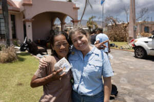 A family receives sandwiches in Kagman, Saipan