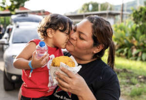 A family enjoys freshly made arepas in Colombia