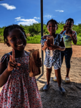 Children enjoying WCK-provided Jamaican patties