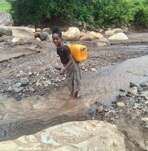 T fetching water for her family