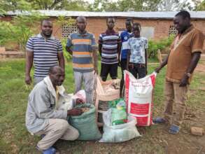Community volunteers receive farming inputs