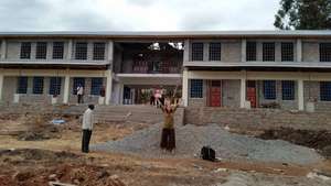 Our founder in front of the new building
