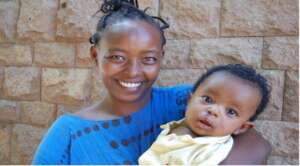 Amen and his mother one day after treatment.