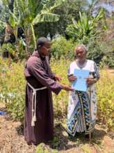 Executive Director handing over land certificate