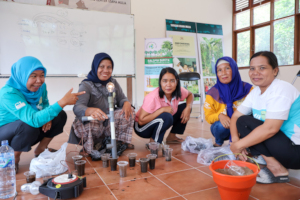 Women farmers learning about the Ph in the soil