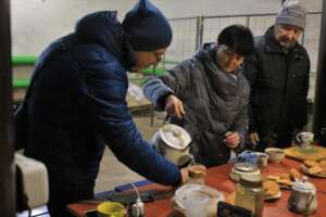 People gather at a heating point in Kharkiv