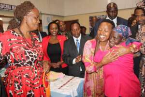 a woman celebrating with Her Excellency,first lady