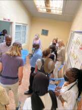 light moment with visiting guests at the project