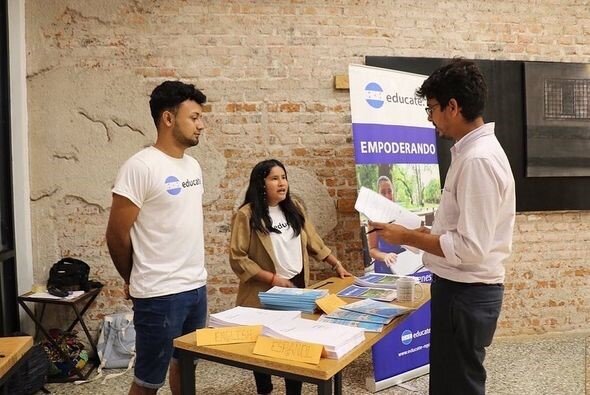 Our scholars being interviewed at the exhibition