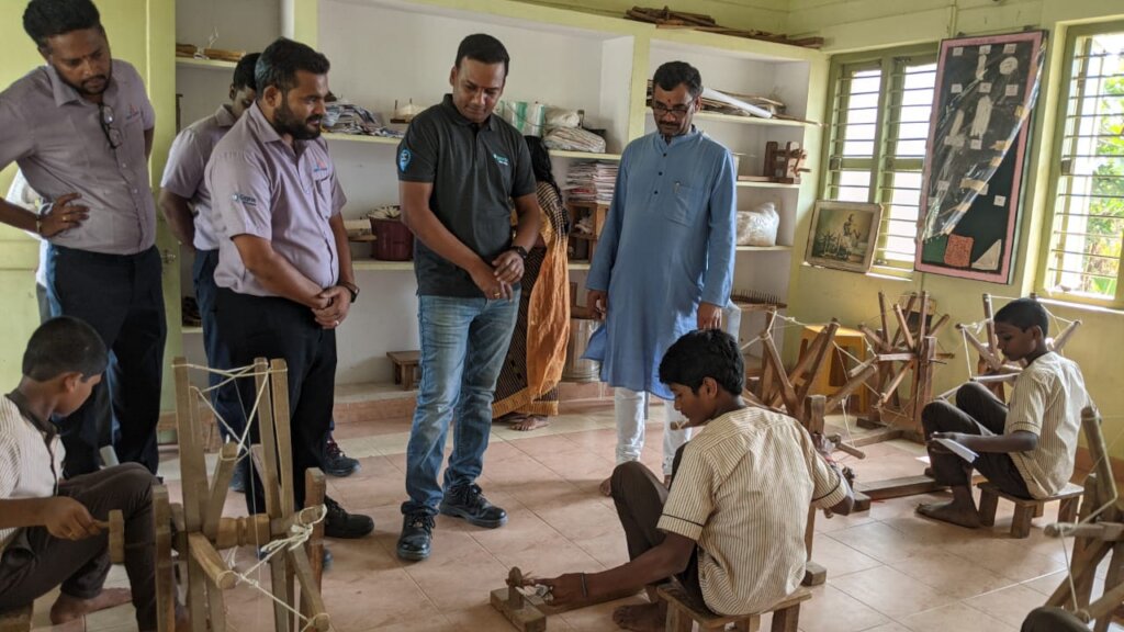Visitors see charkha spinning