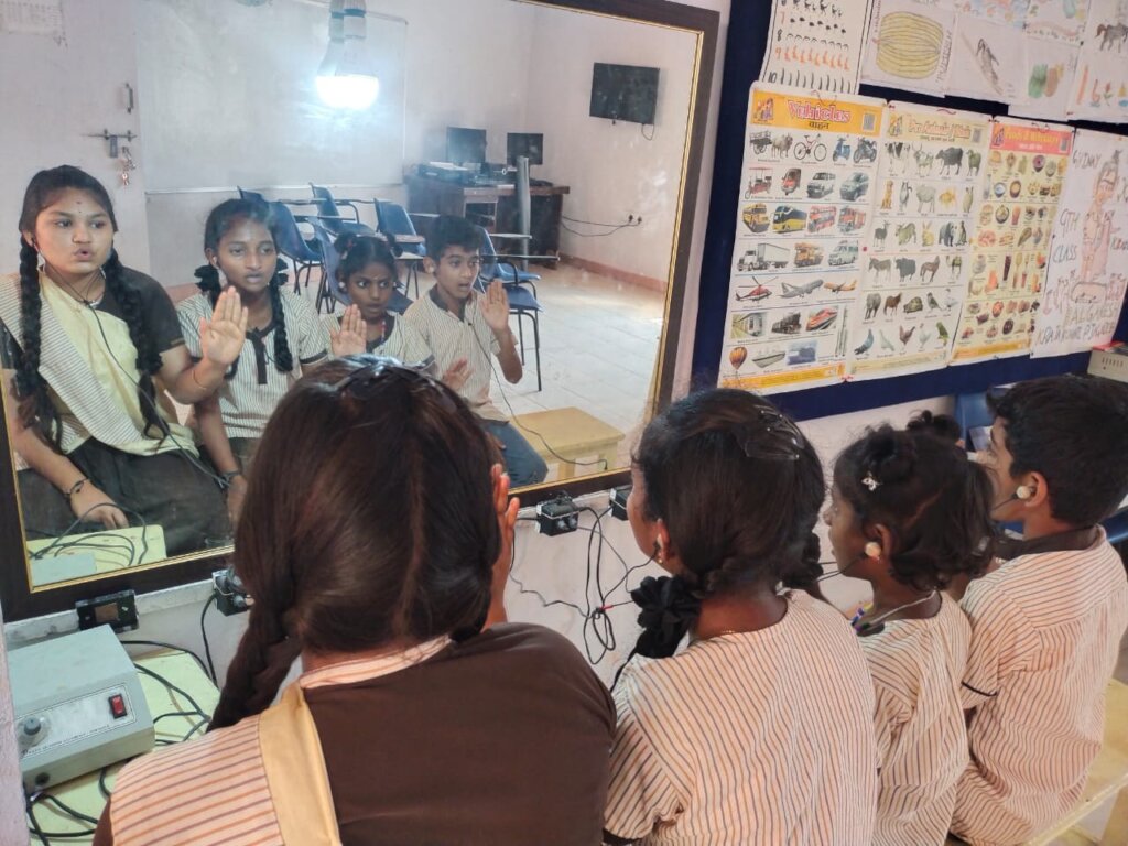 Specially abled children practice speech therapy