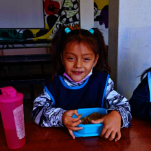Volunteering mothers rotate daily in our kitchens.