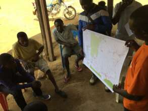 Community members and staff discussing monitoring