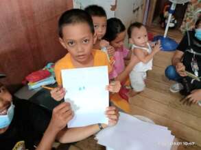 Children in one family meet with visiting teacher