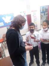 With two students at the classroom