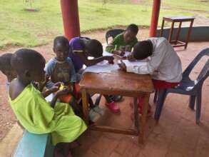 children writing to their sponsors