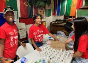 youth volunteers sorting donations