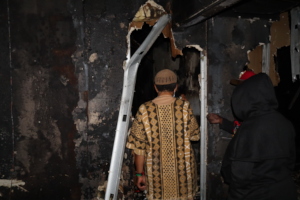Deloyd Parker surveying fire damage