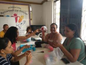 Women learning to knit a hat