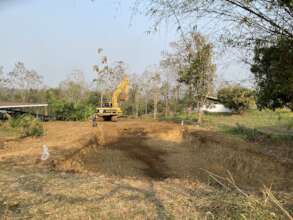 Backhoe with catchment holding tank pit