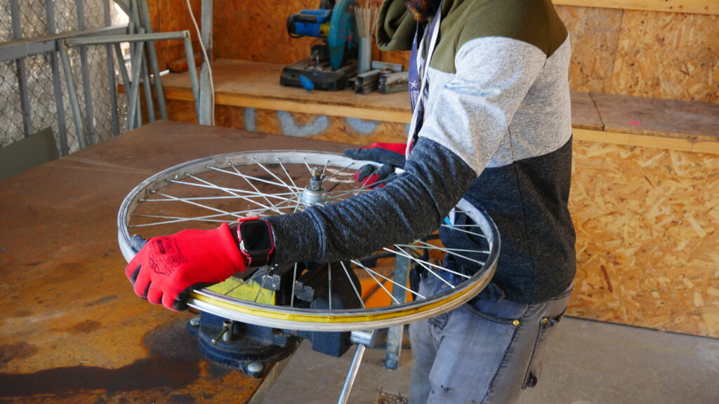 Our bicycle mechanic working on a tire