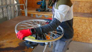 Our bicycle mechanic working on a tire