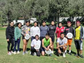 Hector (red shirt) and the frisbee club