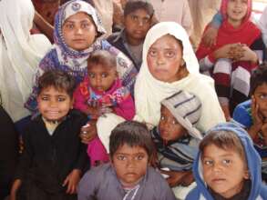 children waiting for warm clothes