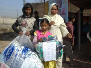 blankets and warm clothes received by children