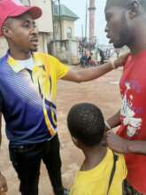 Our Project Leader talking to a blind beggar