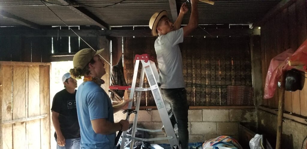 Volunteers Installing Solar For A Family