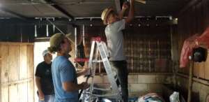 Volunteers Installing Solar For A Family