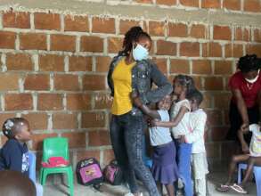 Students playing games with a preschool teacher