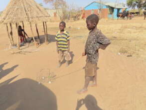 Kids waiting around the empty wells playing