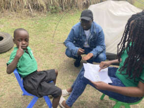 Esther practicing her sign language numbers