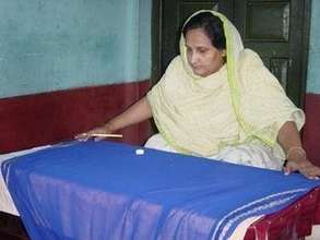CDS-Sponsored Woman Working on Garmets