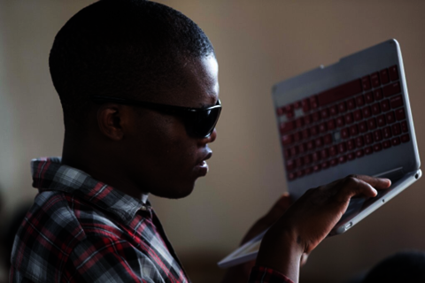 Wambua using a Chromebook