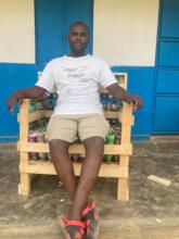 Project Manager Sitting in Our 1st Ecobricks Chair