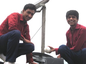 Two students purifying their school's water supply